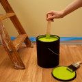 How many sq ft does a 5 gallon bucket of paint cover?